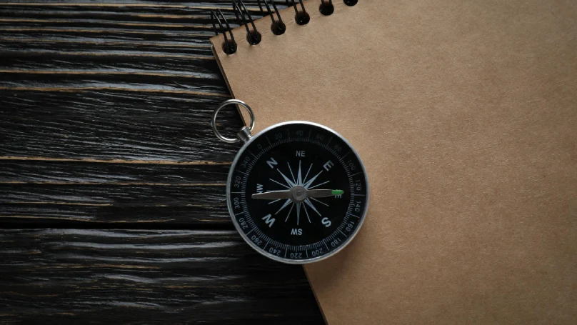 A compass on a map symbolizes direction and focus.