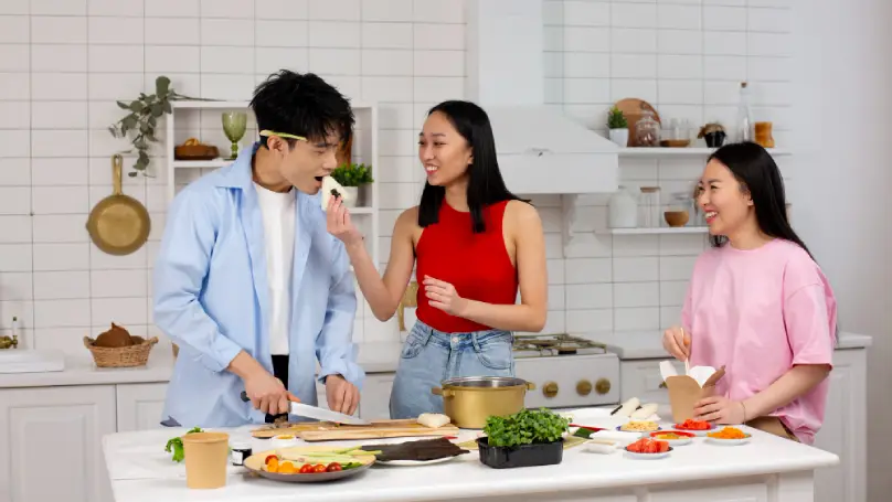 A family cooking or exercising together,